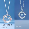 Elegant silver moon snake pendant with pink crystals and feather necklace motif - Snake Moon + Feather Style