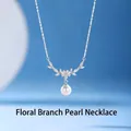 Elegant silver-toned floral branch necklace with crystals and a round white pearl pendant - Flower Branch Pearl