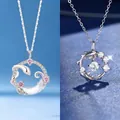 Elegante zilverkleurige maan en slang hanger ketting met schitterende kristallen - Spiritual snake on the moon + good luck koi