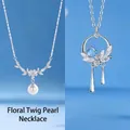 Elegant minimalist silver pearl and blue stone necklace set with floral design elements - Floral Branch Pearl and Fanghua