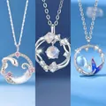 Set of elegant silver-toned necklaces with snake, ginkgo and mermaid tail pendants - Snake Moon + Feather + Fish Tail Style