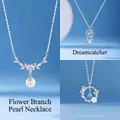 Selection of elegant necklaces with pearl, dreamcatcher, and butterfly designs for women. - Floral Branch Pearl and Dreamcatcher and Butterfly