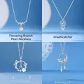Elegant set of four delicate silver necklaces with pearl and blue gemstone butterfly pendants - Floral Branch Pearl and Dreamcatcher and Butterfly and Fanghua