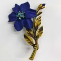 Vintage dark blue flower brooch with crystal rhinestones and a bronze stem detail - Blue