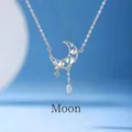 Elegant silver moon pendant necklace with blue moonstone and dangling star charms - Moon and Star Style