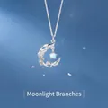 Elegant silver crescent moon necklace with opal star on blue starry background - Moonlight Branch Style