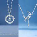 Elegant silver necklaces featuring crescent moon and feather circle pendants with stones - Feather and Moon Duo