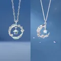 Elegant silver feather and moon pendant necklaces with opal-like stones for women - Feather and Branch Duo