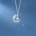 Elegant silver moon branch necklace featuring an iridescent opal-like stone pendant - Moonlight Branch Style