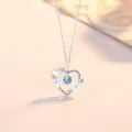 Elegant silver heart pendant necklace featuring blue crystal and floral details - Heart's Delight