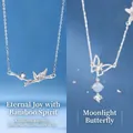 Elegant silver bamboo joint and butterfly pendant necklaces for women, blue background - Bamboo Joint and Moonlight Butterfly Style