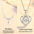 Elegant silver-toned heart pendant necklace with dancing stone center detail - Floral Cluster and Heartbeat