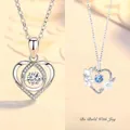 Elegant silver heart pendant necklace with shimmering floral and blue stone details. - Heartbeat and Wild Joy