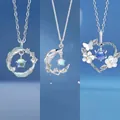 Set of silver-toned necklaces with heart, moon, and feather pendants - Feather Branch and Heart Trio