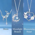 Silver plated moon and flower heart pendant necklaces with blue gems - Moon Branch and Heart Trio
