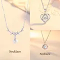 Elegant floral pearl necklace in silver finish with sparkling zircon accents - Clusters of Flowers, Heartbeat for You & Blue Eucalyptus and Bird