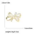 Eleganter goldener Schleifen-Brosche mit Strasssteinen, 2,6 cm x 1,6 cm, 3,4 g - Gold