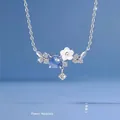 Dromerige bloemenketting met blauwe sterrenlichtsteen en schelpenblaadjes - Bloemen Stijl