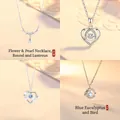 Set of four elegant floral and heart pendant necklaces in silver finish - Flowers in Bloom + Heartbeat for You + Elated Heart + Blue Eucalyptus & Bird