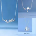 Elegant set of bamboo, flower, and whale tail pendant necklaces with sparkling crystals - Bamboo Flower and Whale Styles