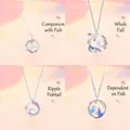 Elegant silver-toned whale and fish themed necklaces featuring pearl and crystal pendants - Four-Piece Set