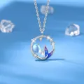 Elegant mermaid tail pendant necklace featuring a glowing moonstone in silver finish - Mermaid Bond