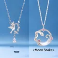 Elegant silver moon snake and bird necklaces with sparkling pink and clear crystals. - Bird and Moon Snake Set
