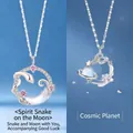 Silver-plated necklace with snake moon and planet Saturn pendants featuring faux moonstone inlay. - Snake Moon And Universe Planet