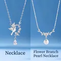 Elegant silver finish necklaces featuring bird wreath and pearl branch design pendants - Bird and Floral Pearl Set