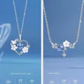 Minimalistische elegante ketting met bloem- en harthanger en schitterende blauwe stenen - Hart in Bloei + Bloemen Verwelken Nooit / 2 Stuks - Simpel Model