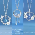 Elegante zilveren kettingen met vlinder- en hartvormige hangers van blauw kristal - Vlinder en Bloem + Prachtige Jaren + Vreugdevol Hart / Set van 3 - Simpele Stijl