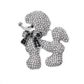 Detailed view of a sparkling poodle brooch encrusted with clear and black rhinestones - White