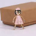 Cartoon nurse brooch with pink enamel dress, faux pearl accents, and rhinestone feet - Pink