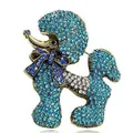 Elegant poodle brooch with sparkling blue rhinestones on antique gold metal. - Blue