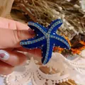Elegante donkerblauwe zeester broche met sprankelende lichtblauwe strassteentjes voor dames - Zeester Stijl (Zeester) / Blauwe Zeester