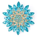 Elegant gold-tone snowflake brooch with marquise blue crystals for formal wear - Blue