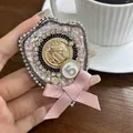 Retro pink tweed bow brooch with rhinestones and golden crown crest, measuring 7.5cm - Bowknot Number 5 (A0-5-5871) / Pink
