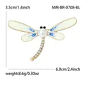 Elegant dragonfly brooch pin featuring white enamel wings pearl and sparkling rhinestones - Blue
