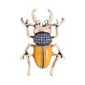 Close-up of a vintage style beetle brooch with blue rhinestones and yellow enamel - Yellow and Blue Beetle (D3-4-6858)