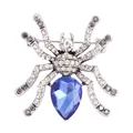Detail of spider brooch with sparkling rhinestones and a large blue teardrop crystal - Blue Spider (B2-2-5117)