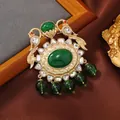 Vintage royal style brooch with large emerald green stone and gold-tone bird detail - Emerald Birds Court Style (5)