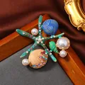 Elegant vintage enamel starfish and seashell brooch adorned with pearls and colorful crystals. - Ocean Shell Starfish Mixed Style (11)