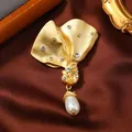 Elegant vintage matte gold ribbon brooch embellished with crystals and a white pearl drop - Matte Gold Ribbon Brushed Style (16)