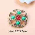 Elegant vintage Baroque cross brooch with green and red resin beads and rhinestones - White