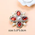 Vintage baroque gold brooch featuring red teardrop stones and white pearls detail - Purple