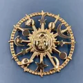 Detailed close-up of a vintage celestial sun face gold brooch with stars and moon - Sun God Face (BQ01)
