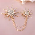 Elegant gold-tone sunburst brooch with sparkling rhinestones and layered tassel chains - Gold