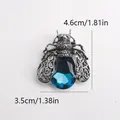 Vintage zilveren insectenbroche met groot gefacetteerd blauw kristal en afmetingen - Blauwe Vlieg (k7-2-3021)