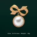 Detail view of vintage baroque gold bow brooch with round white pearl pendant - Gold Matte Bow Artificial Pearl Style (5089421201390)