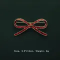 Detail view of Baroque red enamel bow brooch with 5.5cm size and 9g weight information - Red Bow Style (5089421201389)